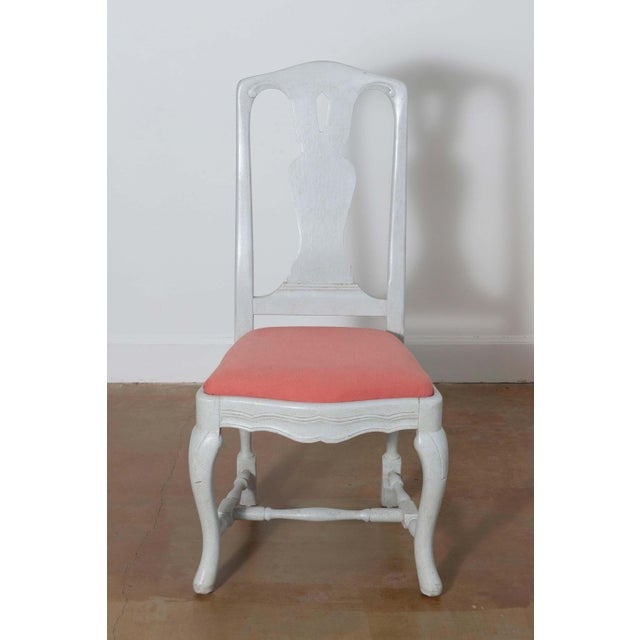 This set of 12 19th-century side chairs, circa 1880, exemplifies the refined elegance of Swedish design from the late 19th...