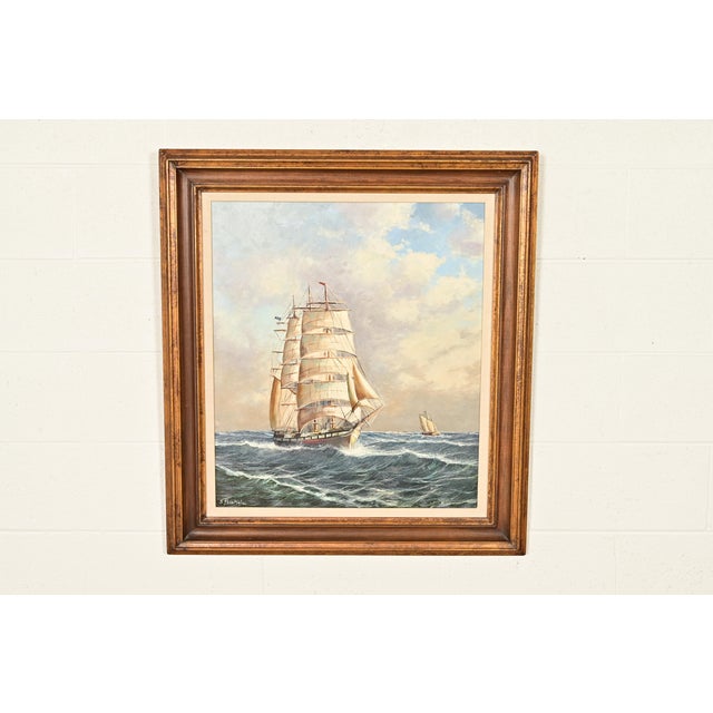 A beautiful oil painting on canvas of a seascape scene with clipper ship in carved giltwood frame Originally painted by...