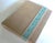 Rare! Brand New. Gorgeous R & Y Augousti, Paris photo album, crafted in metallic khaki beige leather with turquoise blue...