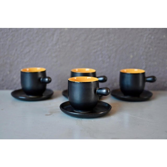 This unique and colorful tea and coffee set comprises four cups, four saucers, a sugar bowl, and a teapot or coffee pot....