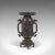 This is an antique decorative twin-handled vase. A Japanese, bronze Meiji period vase, dating to the late 19th century,...