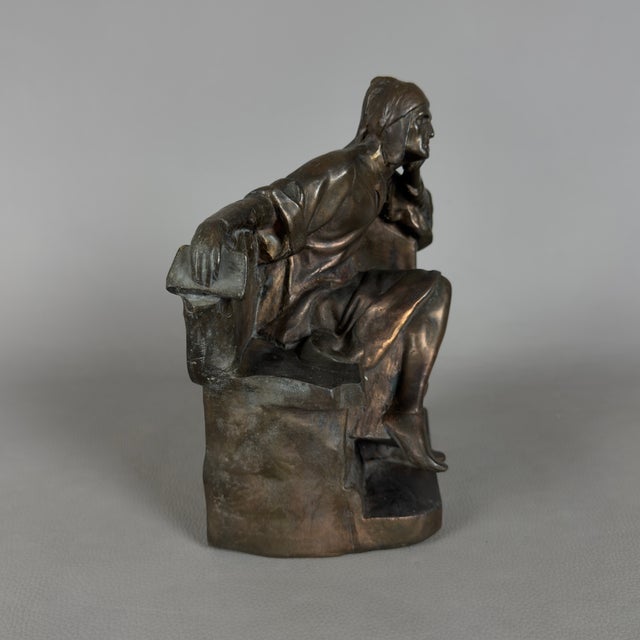 A striking freestanding sculpture depicting Dante Alighieri, attributed to early 20th-century Italian craftsmanship....