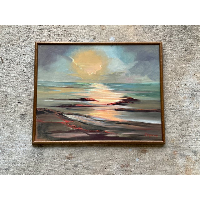This vintage framed seascape oil painting beautifully captures the peaceful grandeur of the ocean through luminous color...