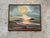 This vintage framed seascape oil painting beautifully captures the peaceful grandeur of the ocean through luminous color...