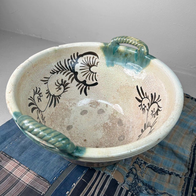 This impressive antique bowl from Japan is a rare example of Seto Oribe pottery, crafted around 1900. Dimensions: Height...