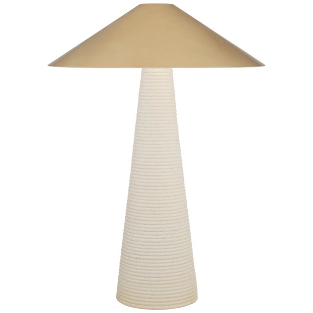 Miramar Table Lamp in Porous White with Antique-Burnished Brass Shade Designer: Kelly Wearstler Height: 33" Shade Detail:...