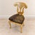 Make a bold statement with this distinctive French-style accent chair, featuring an exceptionally sculptural gold leaf...