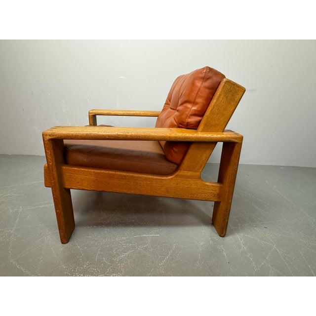 Brutalist-style Bonanza lounge chair designed by Esko Pajamies for Asko in 1966. Constructed from solid oak with...