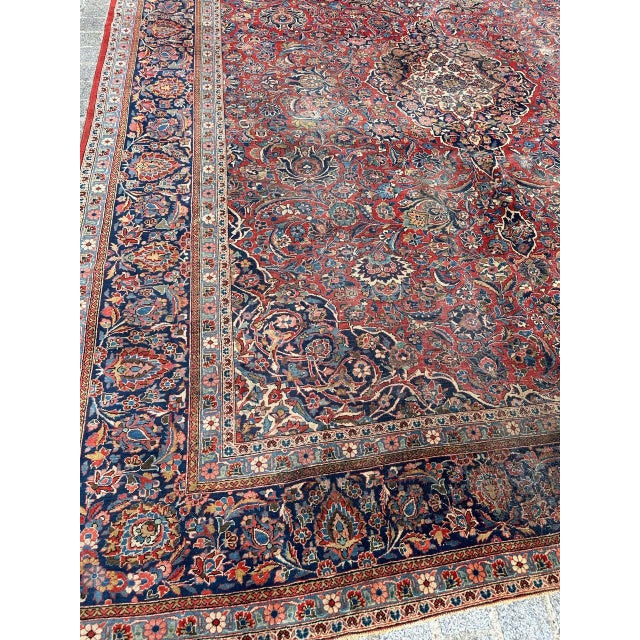 Introducing a Stunning Early 20th Century Large Kashan Rug! Step into the elegance of the past with this exquisite early...