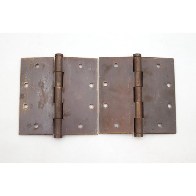 These door hinges are made of oil rubbed bronze finish brass with flat tips, five knuckles, and a template hole pattern....