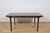 A rare model of a rectangular table with two mechanically extensions, made of teak wood by the British McIntosh...