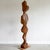 Carved wood floor sculpture of an abstracted figure. Unknown artist.