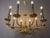 A decorative ten-arm chandelier in the empire style, originating from france, approximately from around 1970. The...