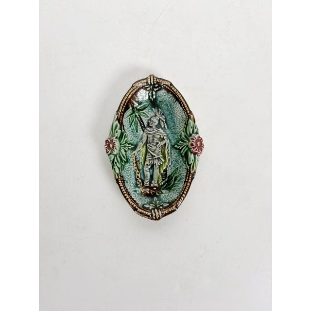 Charming French majolica catchall dating from the 19th century, featuring an elegant oval shape, richly textured ceramic...