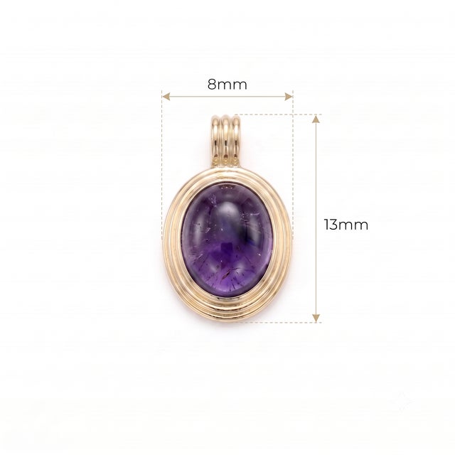 Exude classic sophistication with this deep purple Amethyst cabochon pendant. The smooth dome cut highlights the stone's...