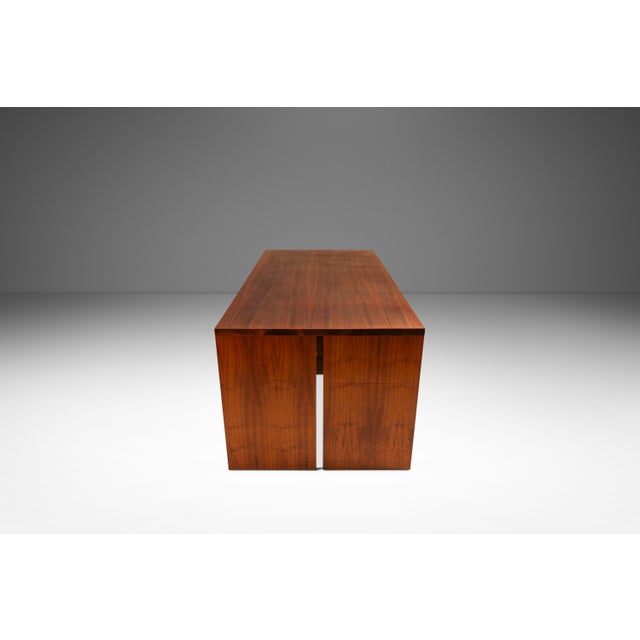 This striking handmade minimalist dining table showcases the clean, sculptural aesthetic of 1980s American studio...