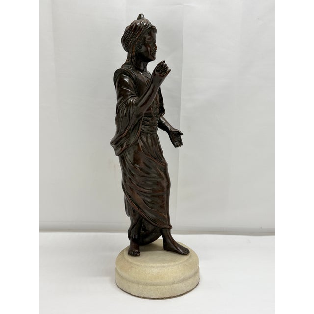 This stunning French-style bronze sculpture exemplifies the elegance and artistic flair of the Orientalist movement, which...