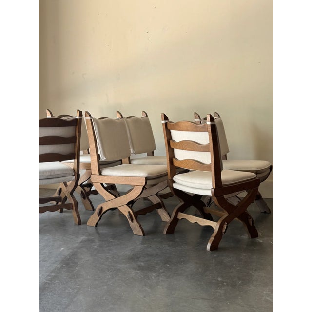Set of 6 solid oak chairs from Germany featuring wedge joint X frames and newly upholstered in a high performance white...