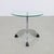 Striking postmodern side table from the 1980s, featuring a triangular glass top resting on a sculptural chrome-plated...