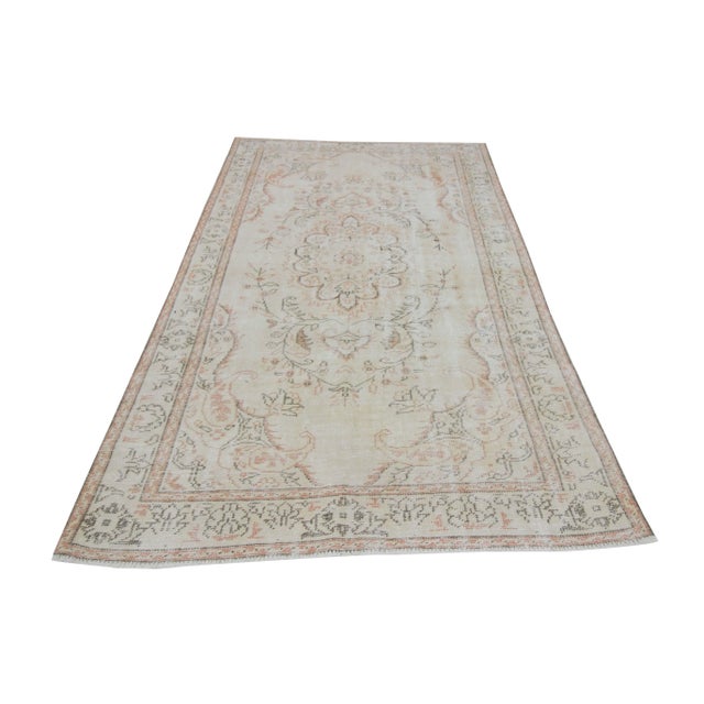 Vintage washed out area rug from Oushak region of Turkey. Approximately 45-55 years old. In very good condition