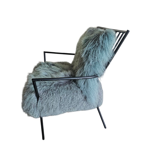 The Ansel chair by Mitchell Gold and Bob Williams is a lounge accent chair in black industrial design metal frame and...