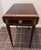 This Pembroke table is made out of mahogany wood crafted with dovetailed drawer construction. It is offered with high-...