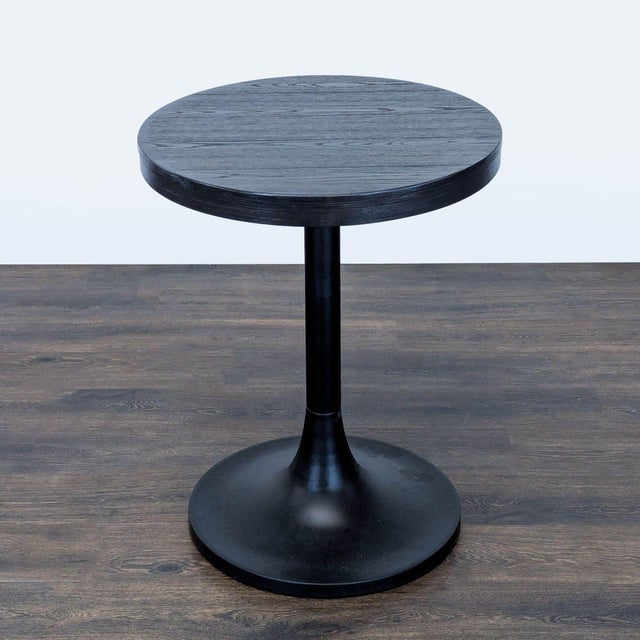 Wood tabletop on metal tulip base. Brand: Williams Sonoma. Dimensions (in): 24W x 24D x 31H.