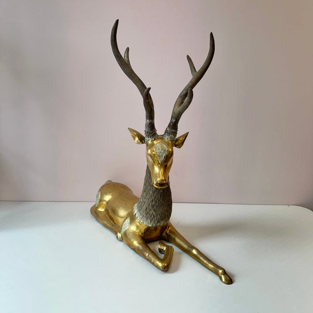 A spectacular extra large vintage brass deer statue with large antlers and ornate detailing throughout. This is a dramatic...