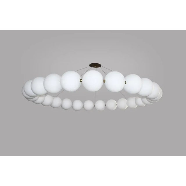 Very large ronde de perles chandelier by ludovic clément d’armont dimensions: ø 175 x h 50 cm. Materials: blown glass and...