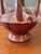 Striking oversized studio pottery vase with dramatic double-loop handles and a rich oxblood red glaze. Likely late 20th...