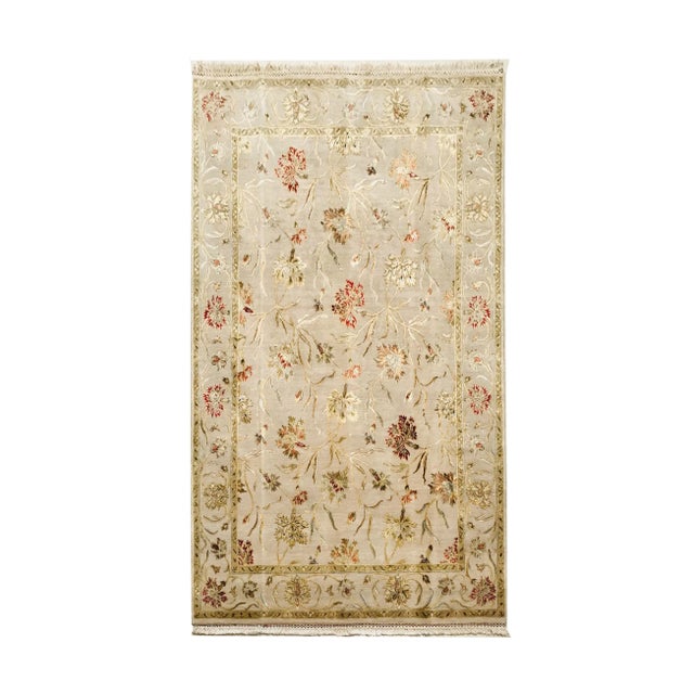 Hand Made in India rug Wool and Silk beige patterned floral green, orange and red. The rug has never been used.