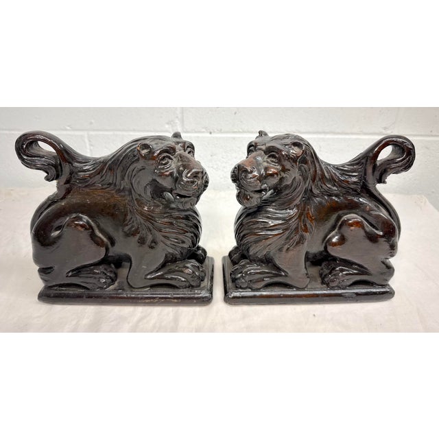 Up for sale is a unique pair of antique 19th century hand carved wood architectural salvage lion sculptures, showcasing...