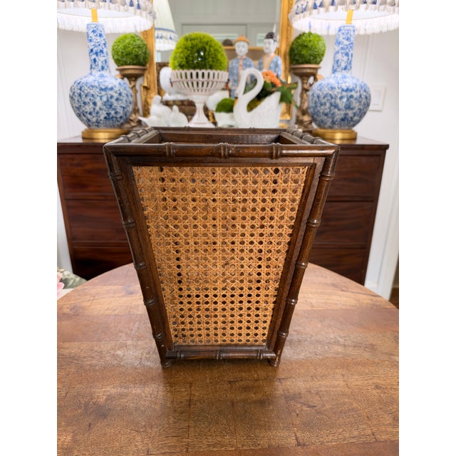Lovely vintage faux bamboo waste basket in solid wood with woven cane siding. Excellent condition Without damage to the...