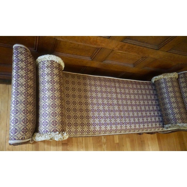 An Ethan Allen cloth footed bench. Gold and purple detailing. 53"L x 19"D x 24"H. We ship from our shop in Lowell, MA....