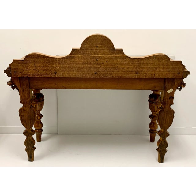 Love this piece! This is an early 20th century English heavily carved oak server or console table or even a sideboard. The...
