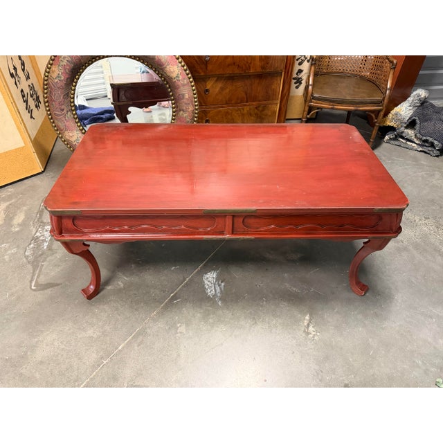 19th century-style Chippendale mahogany cocktail/coffee table. Lovely elegant details define this deep red laquered piece....