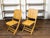 A pair of bamboo folding chairs from the mid 20th century, with light brown patina. Created during the midcentury period,...