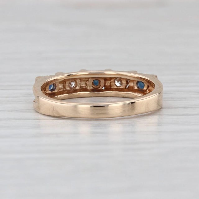 Gemstone Information: - Natural Sapphires - Total Carats - 0.19ctw Cut - Round Color - Dark Blue Treatment - Heated -...