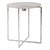 This simple round accent table is fashioned from aluminum metal with a criss cross base. The table top of the piece is...