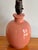 Charming and small salmon pink ceramic lamp, perfect for beside a reading nook or a child's bed. Bottom is felt lined....
