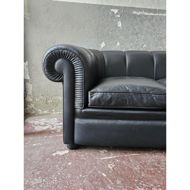 Gorgeous black genuine leather Chesterfield-style sofa. Excellent overall condition with some signs of wear. Goose down...