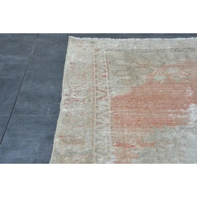 A Turkish handmade vintage Anatolian Oushak rug. We collect old vintage antique rugs from Anatolia, which is the eastern...