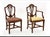 This is a superb set of assembled George III Dining Chairs after a model by George Hepplewhite. The two arm chairs and...