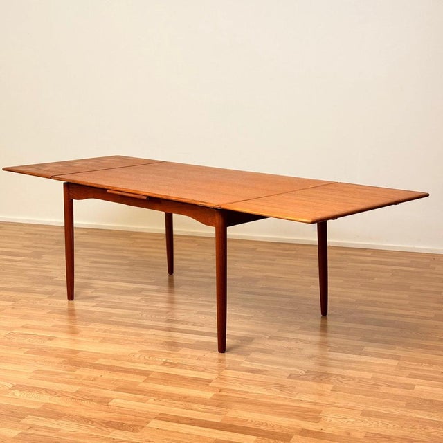 Dining table was manufactured in Denmark in the 1950s-60s . It is made of teak veneer on top surface and in teak wood on...