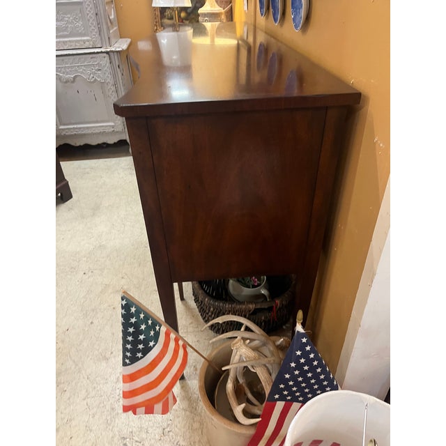 This is a beautiful Mahogany sideboard with silver drawer that appears to have never been used. Does have key for drawer....