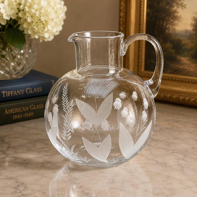 This beautiful vintage Tiffany & Co. etched crystal pitcher is a lovely example of the refined elegance and timeless...