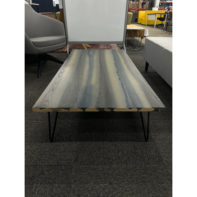 The "Overdyed" Aniline Dyed Ash Veneer Top couch table, designed by the Diesel Creative Team and crafted by Moroso,...