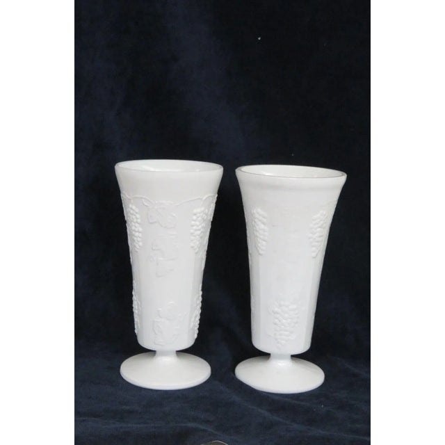 This beautiful pair of vases are made of milk glass. These vases are made in a gorgeous opaque white color, they both have...