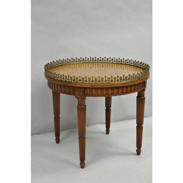 Vintage French Empire Mahogany 25" Round Coffee Table with Ornate Brass Gallery and Carved Tapered Legs. Circa Mid 20th...