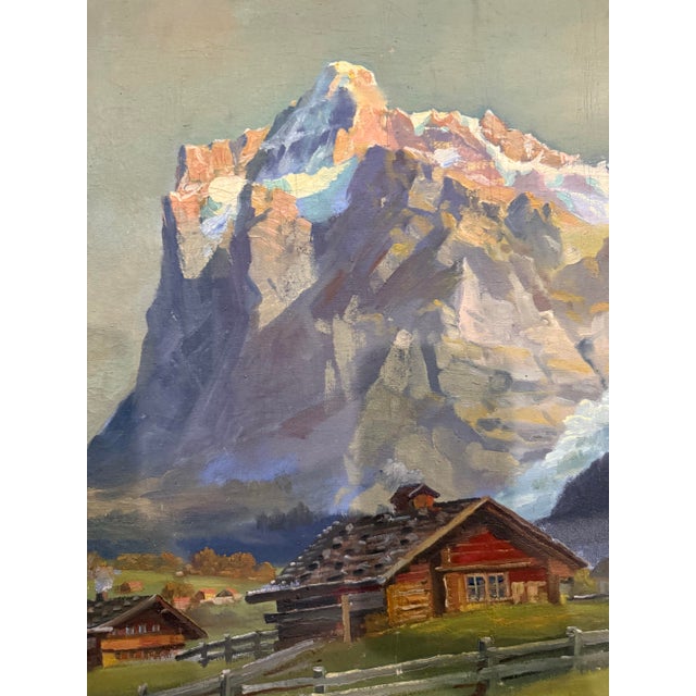 Here is a beautiful, original mid-century oil painting depicting a picturesque European Alpine village nestled beneath a...